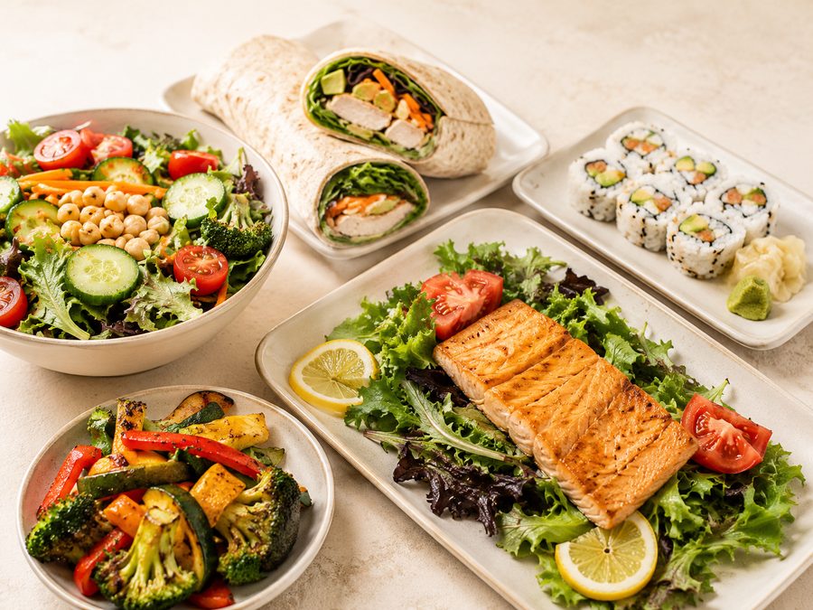 Salads, a grilled salmon plate, a wrap and sushi rolls from Farm & Fare